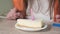 Close-up of a slice of cake with a candle. Lights a candle and blows. 4k video.