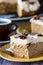 A close up of a slice of pumpkin spice latte cake with espresso frosting.