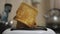 Close-up of sliced fried white bread flying out of an electric toaster. Kitchen appliance used to prepare a healthy