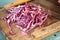 Close up of sliced red cabbage on grater
