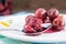 Close up of a sliced sour cherry on spoon