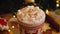 Close-up slider shot of a mug with hot coffee with marshmallows