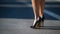 Close up of slim legs of woman wearing high heel shoes. Generative AI