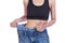 Close up slim woman in old jeans showing thumbs up isolated on w