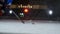 Close-up slow motion hockey puck and flying snow on the ice , hockey player picks up the puck stick