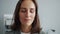 Close-up slow motion portrait of young business lady laughing in office smiling