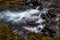 Close-up of the slow water flow of a mountain stream