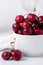 Close up of small bowl of beautiful fresh ripe cherries