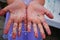 Close up of a small childs hands covered in glitter