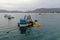 Close up of a small fishing boat with a fishingnet floating alongside