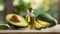 Close-up of small glass bottle of avocado essential oil and fresh avocado on table. Organic product