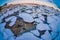 Close up of small and medium pieces of Ice on a frozen lake