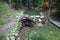 Close up of a small waterfall spilling over moss covered rocks in regional park. Handmade river waterfall