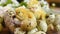 Close-up of small yellow chickens or quail Chicks in plastic packaging with quail eggs against a background of white