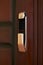Close-up of a smart door lock showing locked