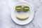 Close up of smile face with kiwi and banana on plate.