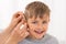 Close-up Of A Smiling Boy With Hearing Aid