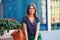 Close-up of smiling elegant woman on bench on the background of