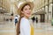 Close up of smiling fashion tourist woman visiting Vittorio Emanuele Gallery in the city of Milan, Italy