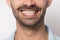 Close up smiling male mouth with white teeth.