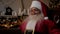 Close up smiling Santa Claus listens children online webcam laptop video call