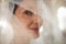 Close Up Smiling Senior Bride Wearing Veil and in Church