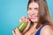Close up of smiling woman drinking green beverage