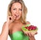 Close up of smiling woman holding raspberries