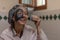 Close-up of a smiling woman while removing the mud mask from her face