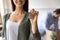 Close up smiling woman showing keys from new house