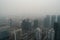 close-up of smoggy city skyline, with buildings and roads obscured