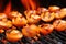 close-up of smoky sizzling scallops on a grill