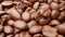 Close-up, smooth moving roasted coffee beans