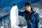 Close up of snowboard girl smiling and posing on mountain and slope background.