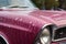 close-up of soapy sponge on classic car hood