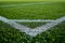 Close-up of soccer field corner line on lush grass