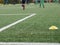 Close-up of soccer turf within kids training.  Green grass