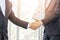Close Up of soft focus two young business man hands people shaking hands, finishing up a meeting Greeting Deal Concept
