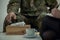 Close-up of a soldier`s hand taking a tissue from a box during therapy