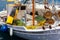 A close up of some small wooden colorful fishing boats at the po