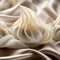 A close up of some white dumplings on a silk cloth, AI