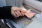 Close-up of someone withdrawing euro banknotes from an ATM