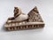 Close-up on a souvenir sphinx and pyramids from Egypt on a white background