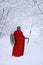 Close up of spartan warrior walking through winter forest .