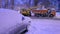 Close-up specialized snowplows unload snow into a truck. Snow plow outdoors.