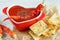 Close-up of a spicy tomato soup with chips