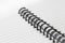 Close up of a spiral bound notebook with black spirals