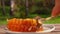 Close-up of the spoon taking a piece of the fresh sweet honey in honeycombs