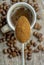 A close up of a spoonful of instant coffee powder