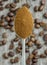 A close up of a spoonful of instant coffee powder